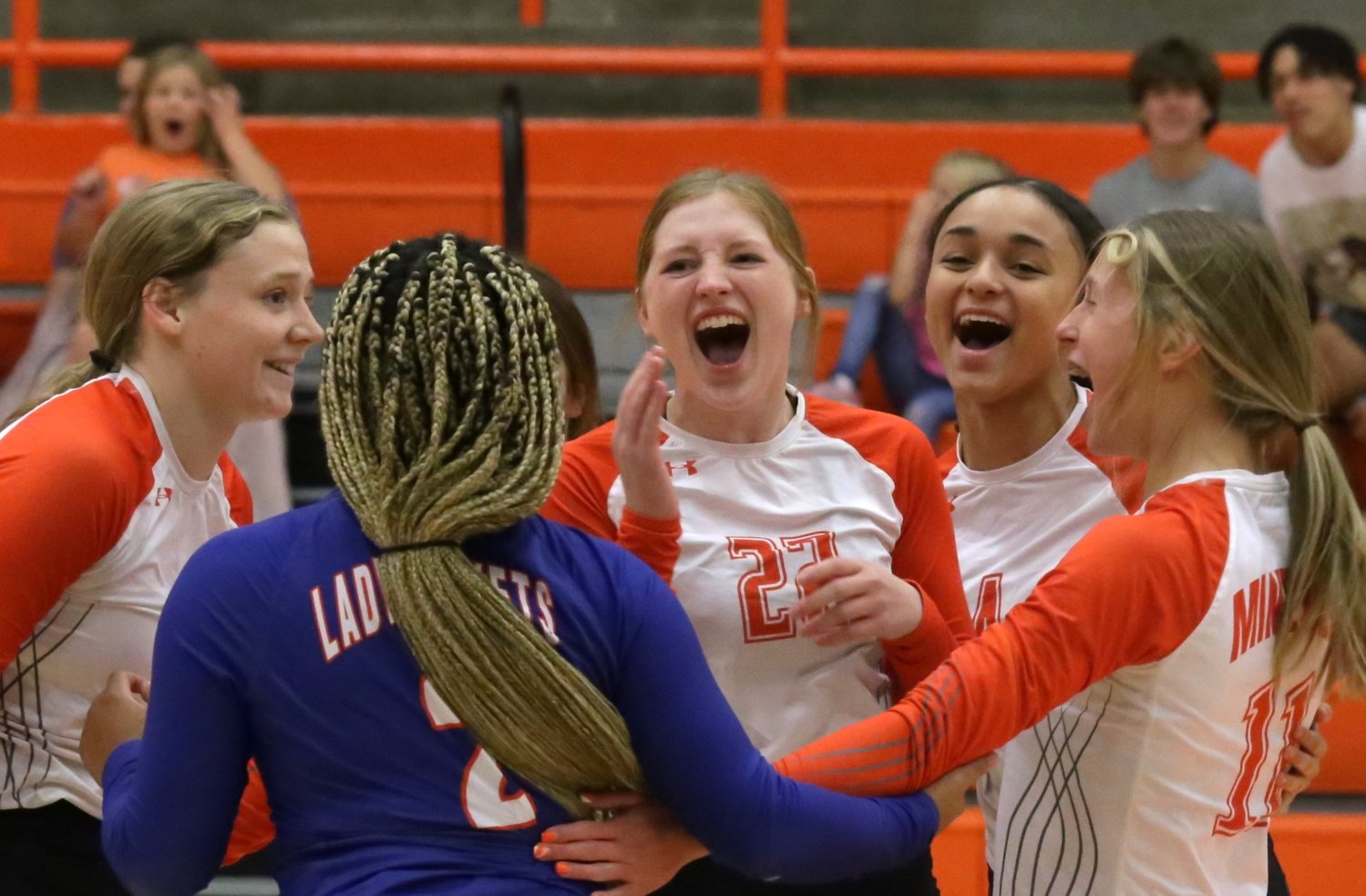 The celebration after the win was well-deserved. From left  are Mylee Fischer, Paris Spigner (libero), Macy Fischer, Jayla Jackson and Olivia Hughes.